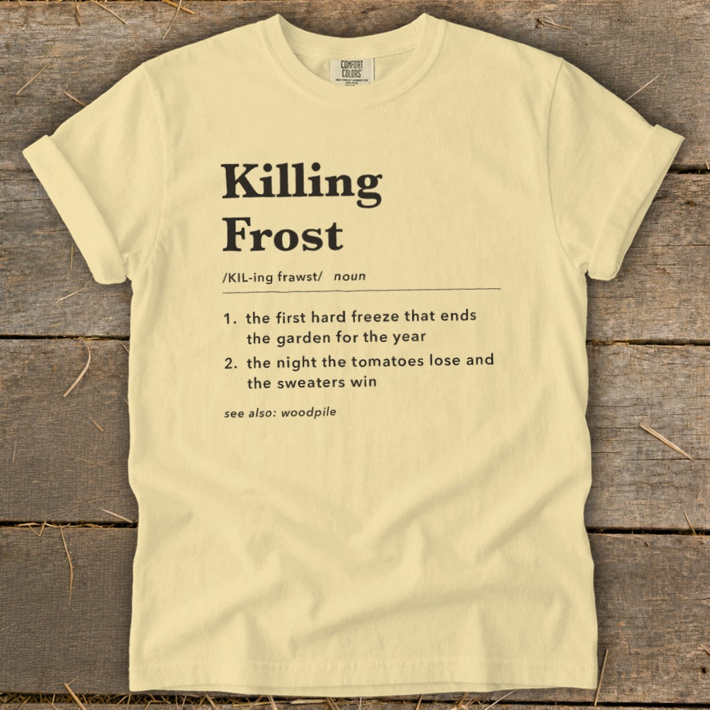 A pale yellow t-shirt features black text defining "Killing Frost" like a dictionary entry.