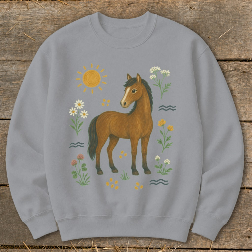 Grey sweatshirt with a brown horse, sun, and floral illustrations.