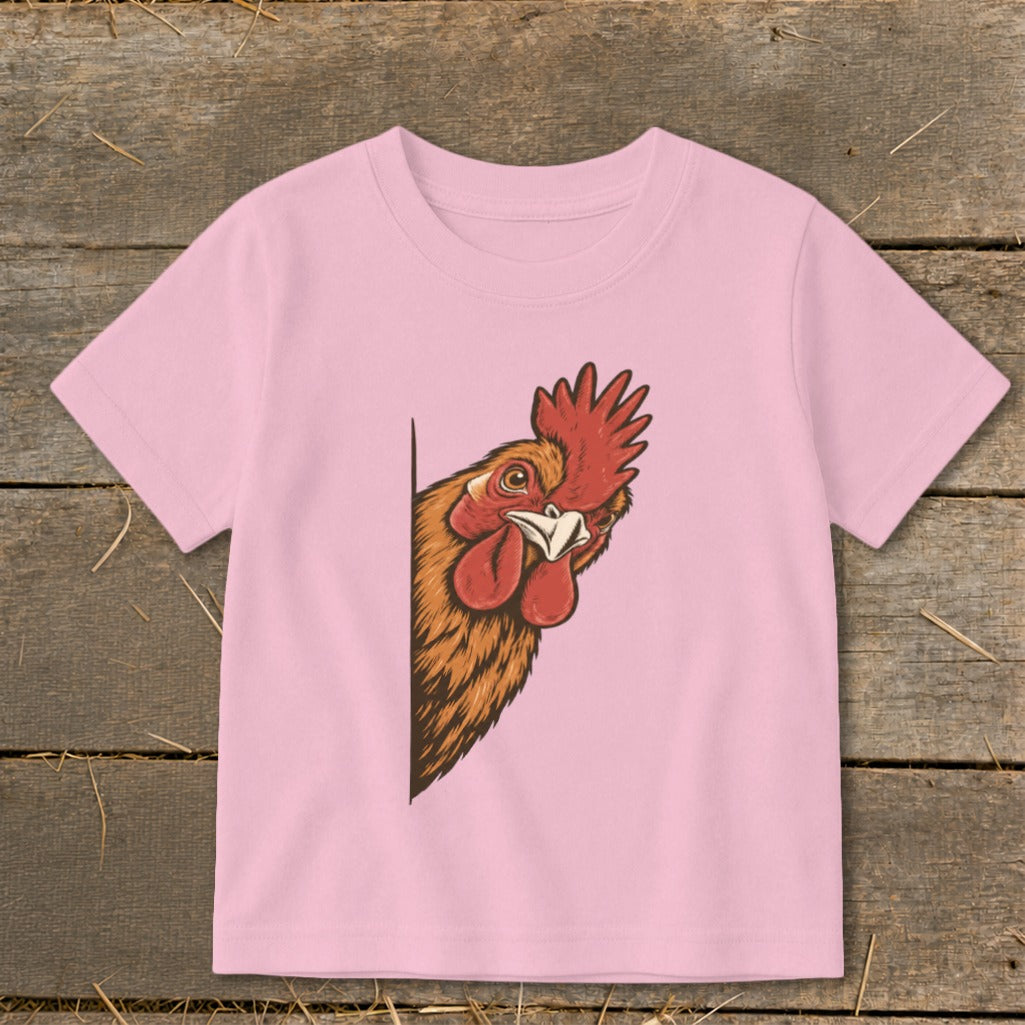 Pink t-shirt with illustration of a rooster peeking from the side.