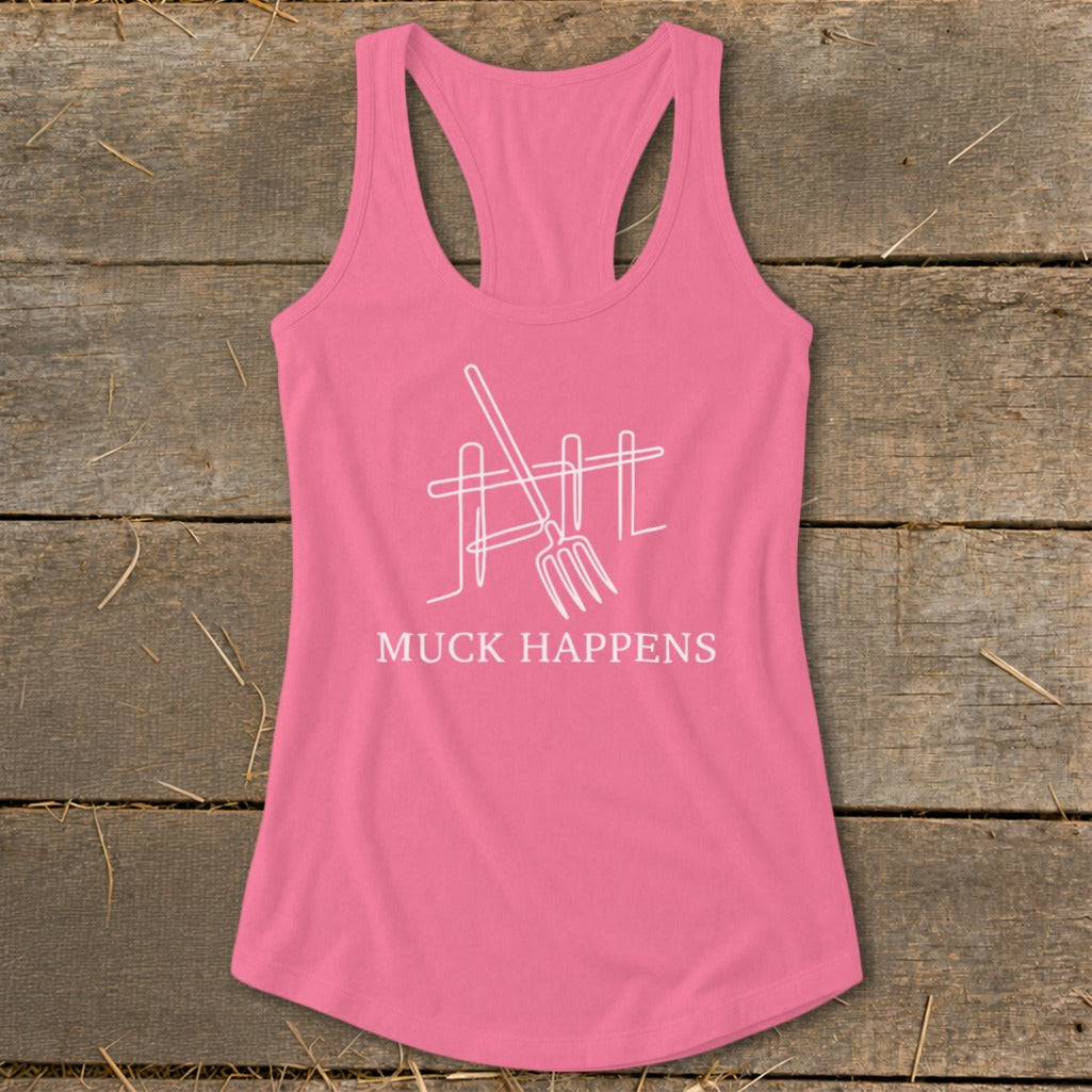 Pink tank top with a white outline graphic of a pitchfork and fence and text "MUCK HAPPENS".