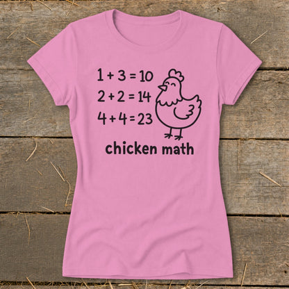 Pink t-shirt with "chicken math" and humorous math equations with a chicken illustration.