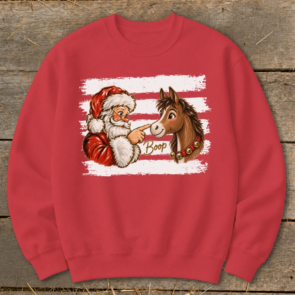Santa boops a horse's nose with the word "Boop" printed between them.