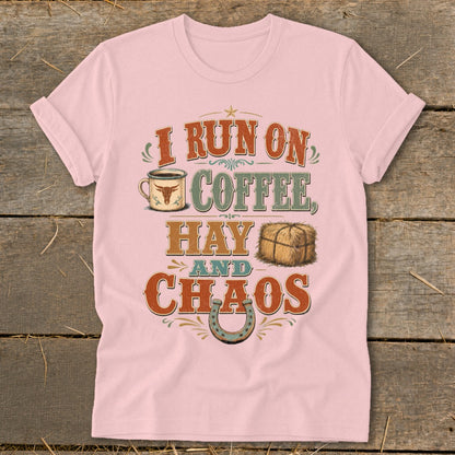 Pink t-shirt with text "I RUN ON COFFEE, HAY AND CHAOS" and graphics.
