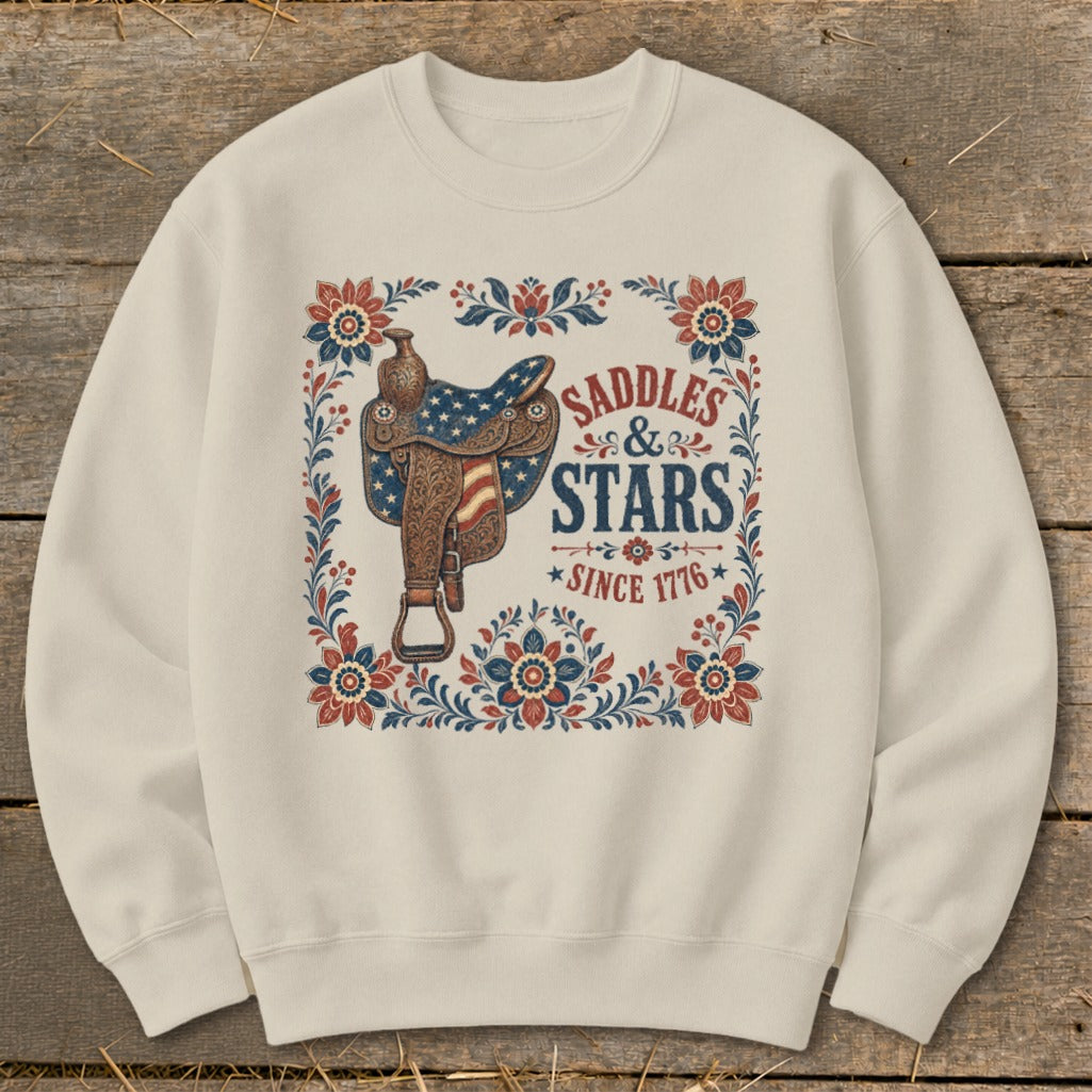 Cream sweatshirt with Saddles & Stars Since 1776 graphic featuring a saddle.