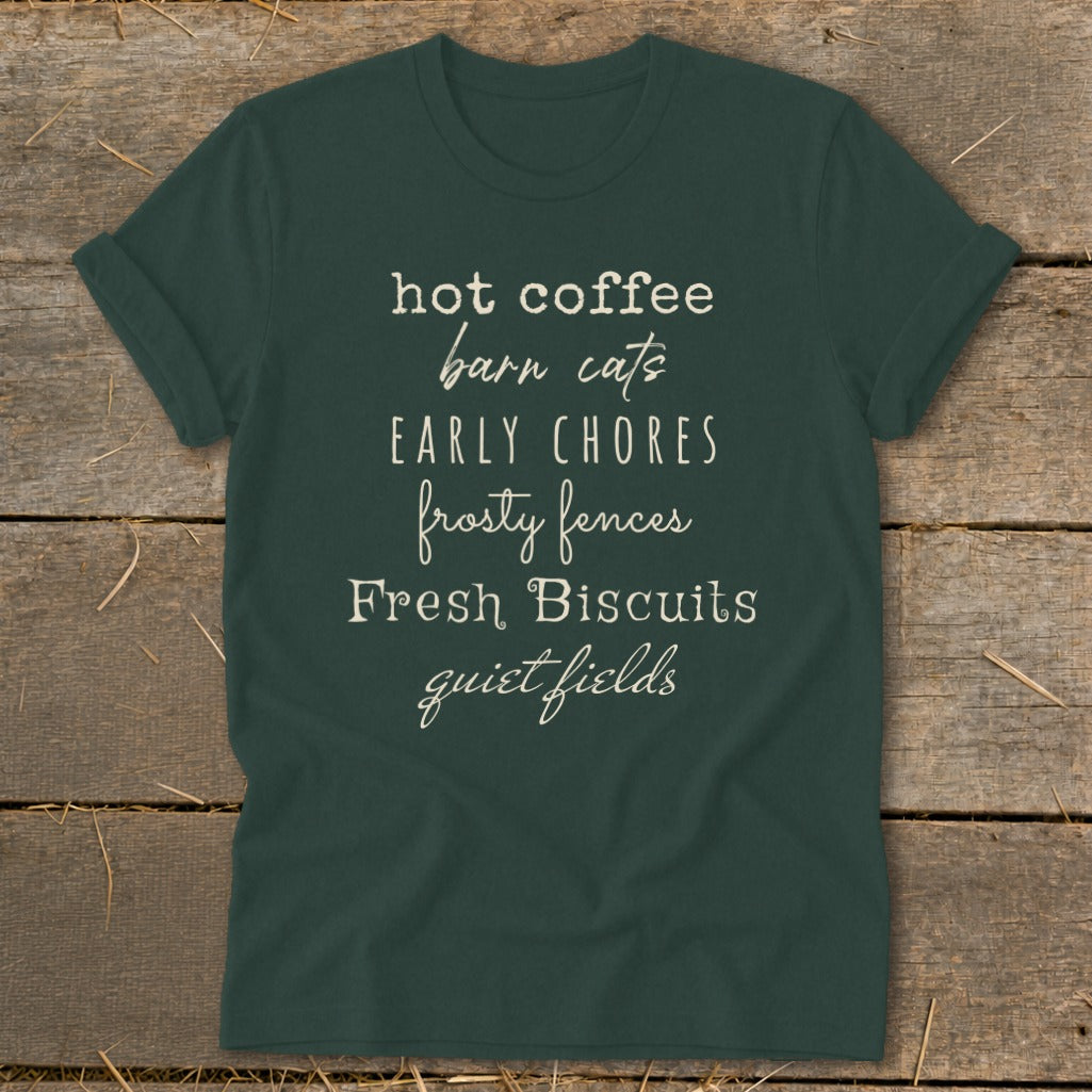 Dark green t-shirt with "hot coffee barn cats EARLY CHORES frosty fences Fresh Biscuits quiet fields" text.