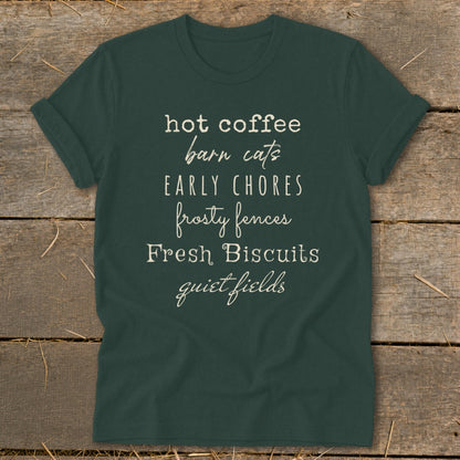 Dark green t-shirt with "hot coffee barn cats EARLY CHORES frosty fences Fresh Biscuits quiet fields" text.