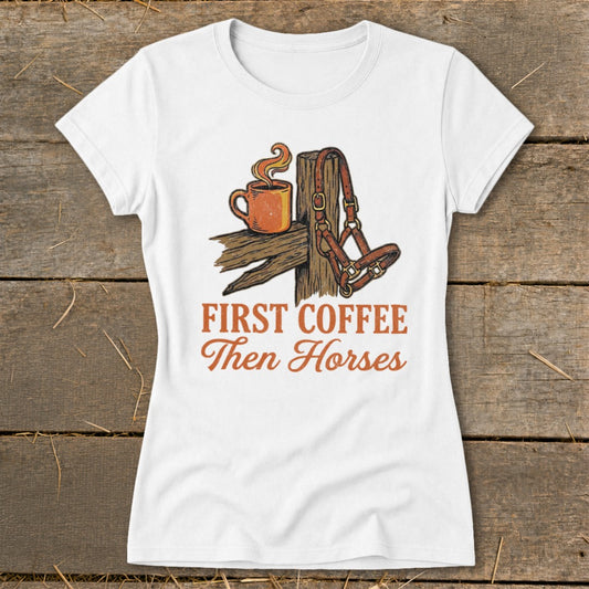 White t-shirt with "First Coffee Then Horses" text and graphic of coffee cup and horse halter.