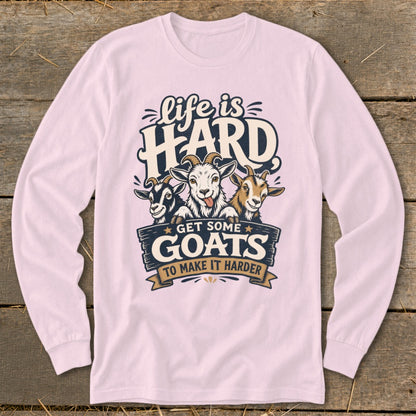 Pink long-sleeve shirt with a graphic featuring three goats and text "Life is HARD GET SOME GOATS TO MAKE IT HARDER".