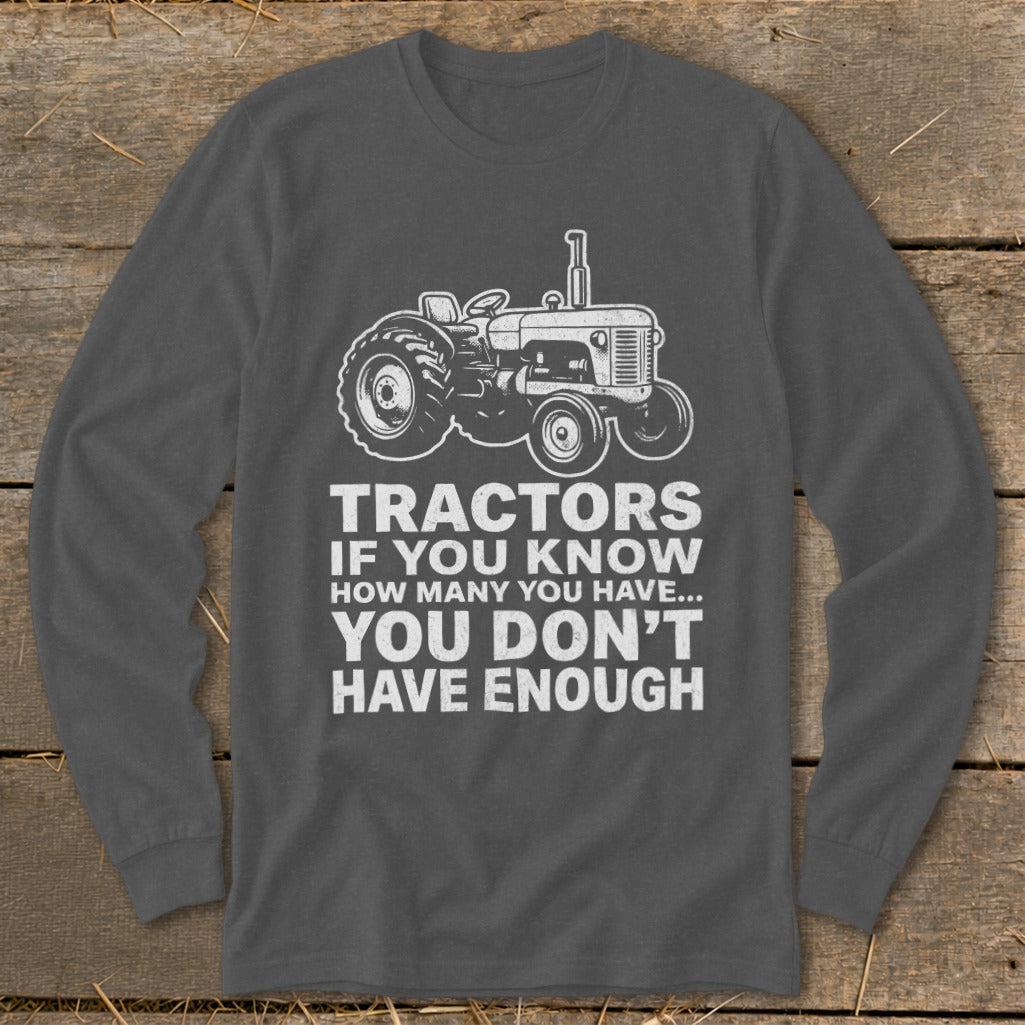 Dark gray long-sleeve shirt with white tractor graphic and text.