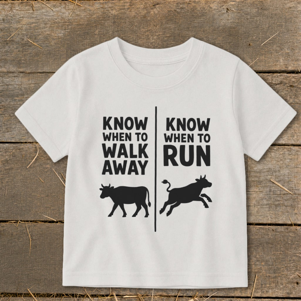 White t-shirt with text "KNOW WHEN TO WALK AWAY" and a walking cow.