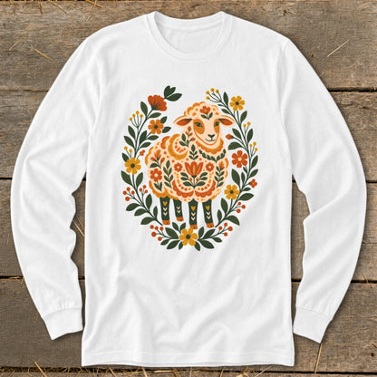 White long-sleeve shirt with a decorative floral wreath and a patterned sheep design.