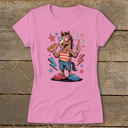 Cartoon horse in sunglasses holding hot dog and sparkler, with fireworks.