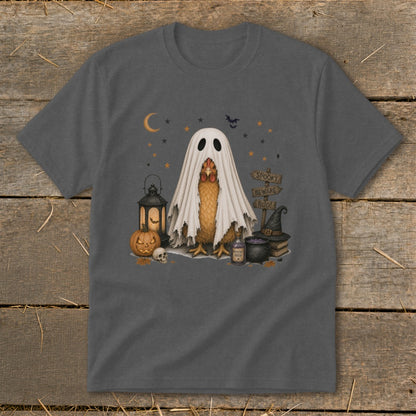 Chicken in a ghost costume with Halloween decorations and spooky sign.