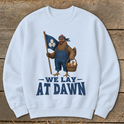 Chicken in overalls holding flag and egg basket with "We Lay At Dawn" text.