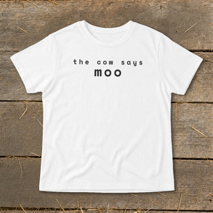 White t-shirt with black text "the cow says moo".