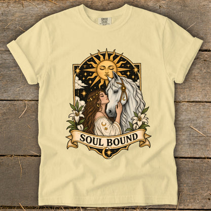 Woman kisses white horse under a sun and stars with "Soul Bound" text.