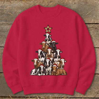 Red sweatshirt with cows arranged as a Christmas tree, wearing Santa hats.