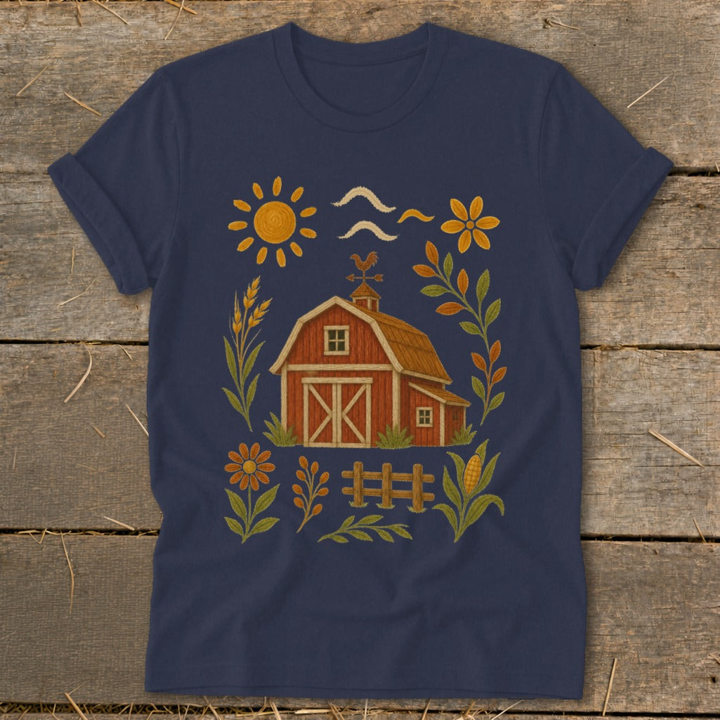 T-shirt graphic with a red barn, sun, flowers, wheat, and corn.