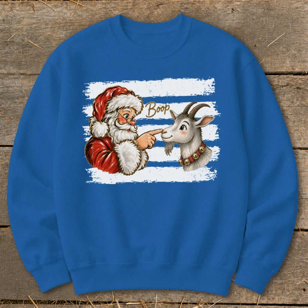 Santa's finger touching a goat's nose with the word "Boop" above.
