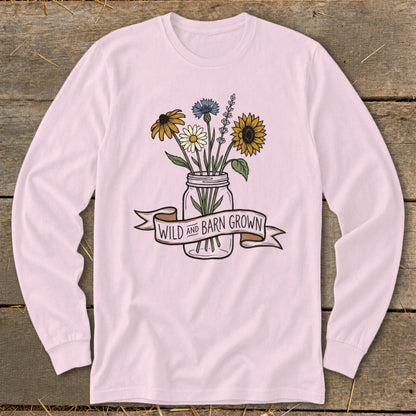 Pink long sleeve shirt with floral arrangement in a mason jar and "Wild and Barn Grown" banner.