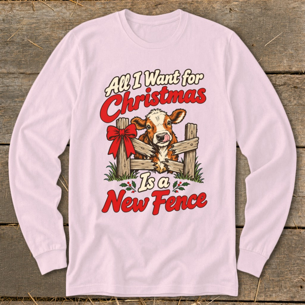 Pink long-sleeve shirt with a cow peeking through a fence and text.