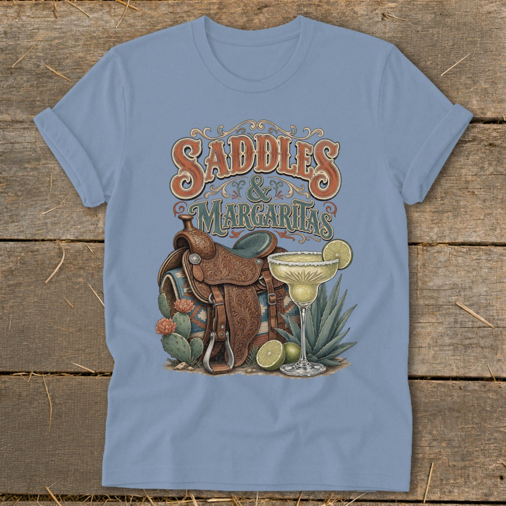 Light blue t-shirt with "Saddles & Margaritas" text, saddle, and margarita.