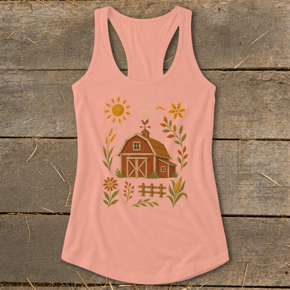 Peach tank top with a red barn and farm graphic, framed by plants and a sun.