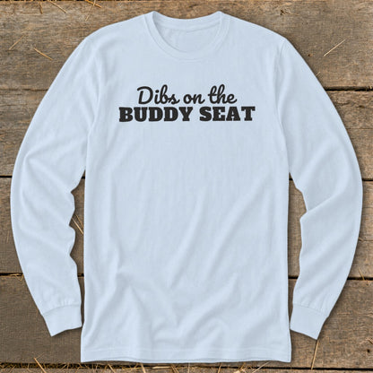 Light blue long sleeve shirt with black text that says "Dibs on the BUDDY SEAT".