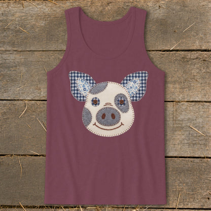 Burgundy tank top with a fabric applique of a smiling pig face.