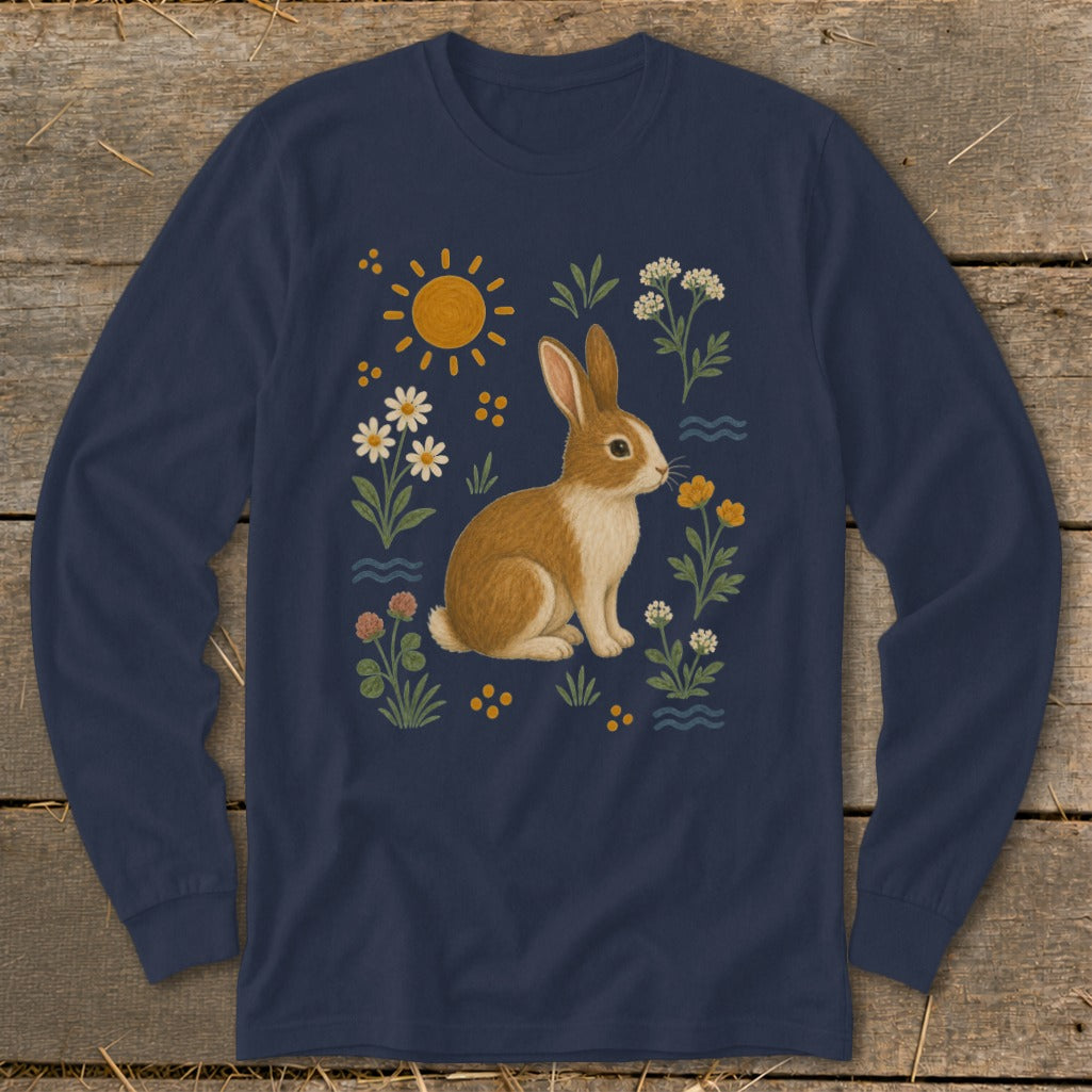 Navy long-sleeve shirt with a brown and white rabbit surrounded by flowers and sun.