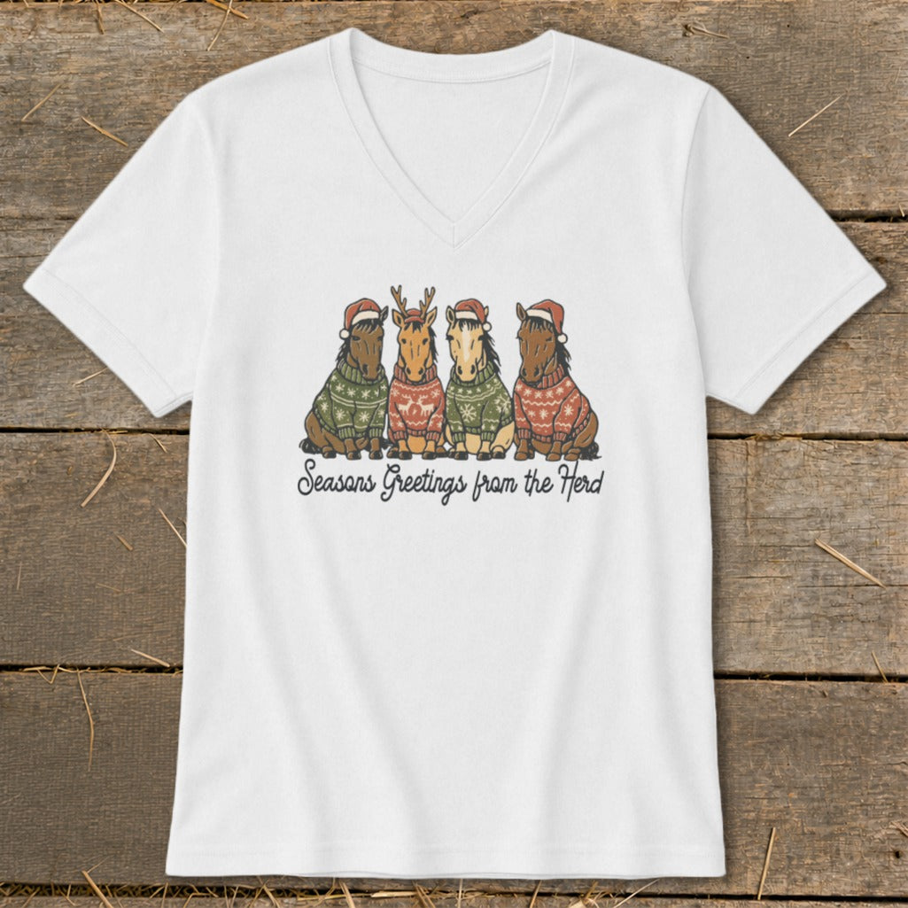 Four horses wearing Santa hats and sweaters, with text "Seasons Greetings from the Herd."
