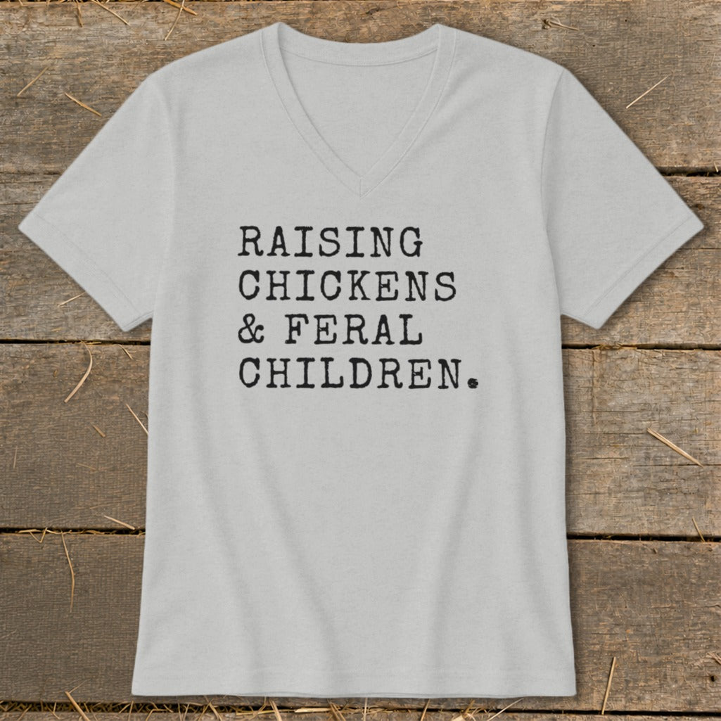 Light gray v-neck t-shirt with text "RAISING CHICKENS & FERAL CHILDREN."