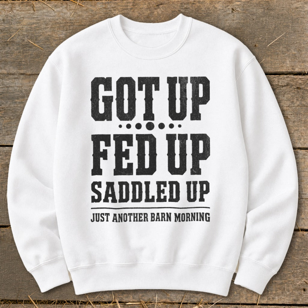 White sweatshirt with "GOT UP FED UP SADDLED UP JUST ANOTHER BARN MORNING" text.