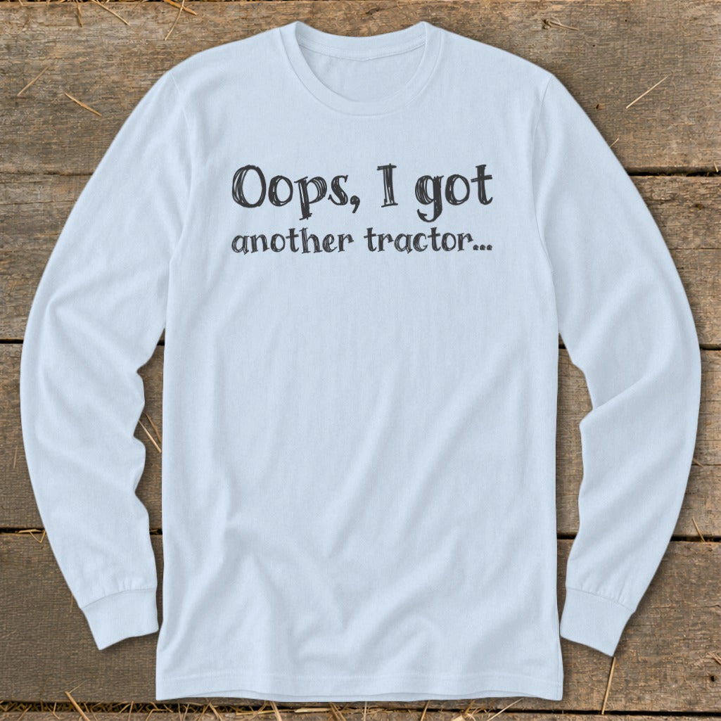 Light blue long-sleeve shirt with text "Oops, I got another tractor..."