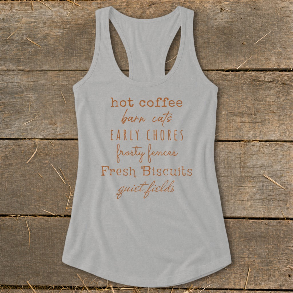 Gray tank top with "hot coffee barn cats EARLY CHORES frosty fences Fresh Biscuits quiet fields" text.