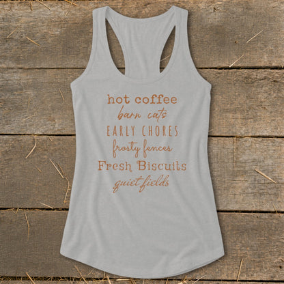 Gray tank top with "hot coffee barn cats EARLY CHORES frosty fences Fresh Biscuits quiet fields" text.