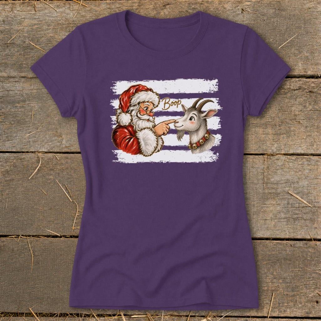 Santa booping a goat with the word "Boop" above them on a purple shirt.