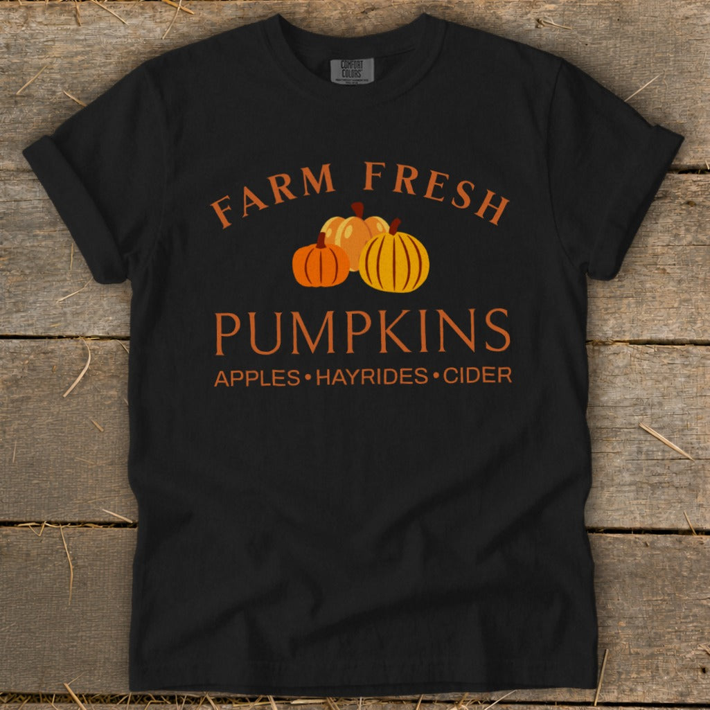 Black t-shirt with "Farm Fresh Pumpkins" text and three pumpkins.