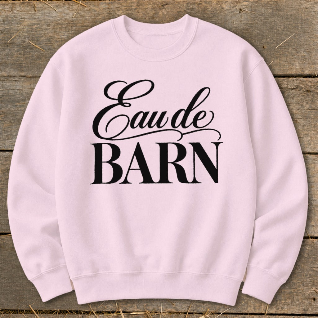 Pink crewneck sweatshirt with black text "Eau de BARN"