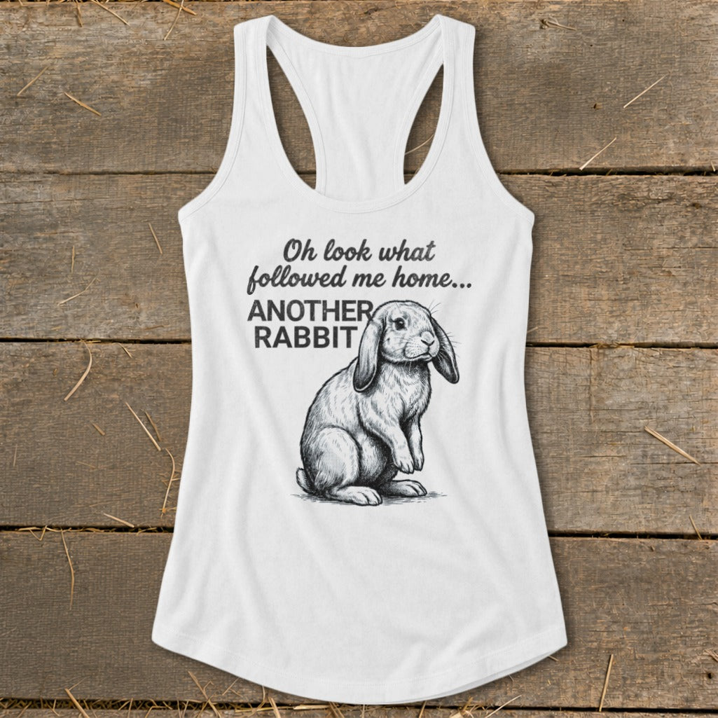 White tank top with drawing of rabbit and text "Oh look what followed me home... ANOTHER RABBIT"
