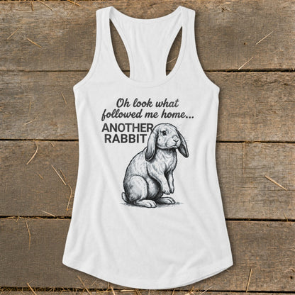 White tank top with drawing of rabbit and text "Oh look what followed me home... ANOTHER RABBIT"