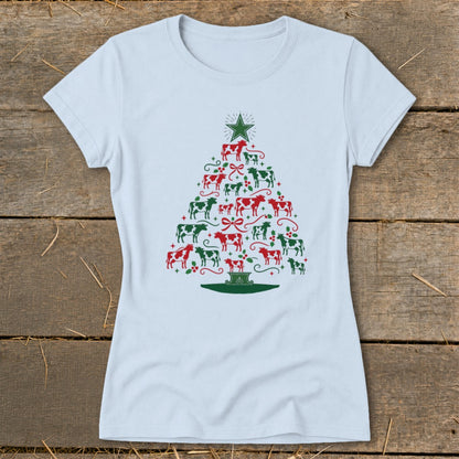 Light blue t-shirt with a Christmas tree design made of red and green cows and holly.