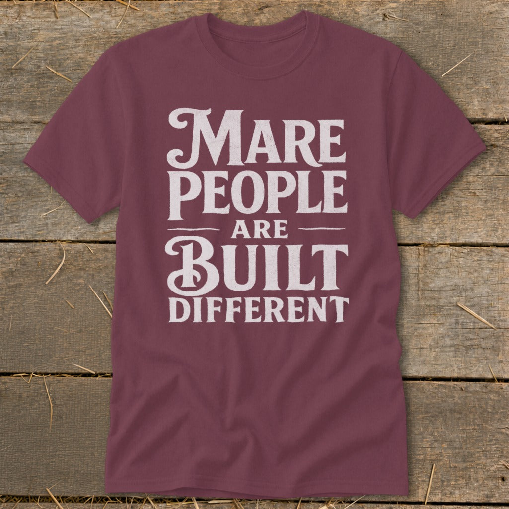 Maroon t-shirt with white text reading "Mare People Are Built Different".