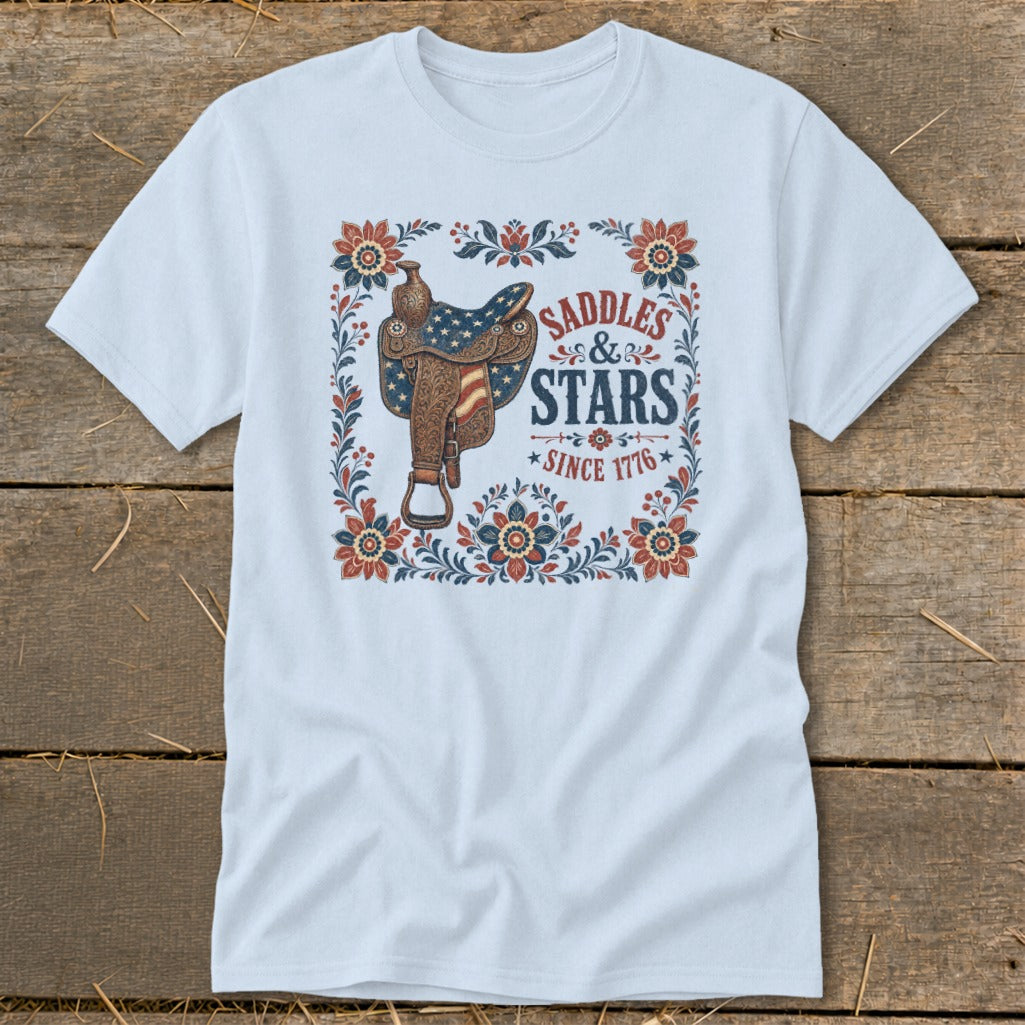 Light blue t-shirt with saddle graphic and text "Saddles & Stars Since 1776".