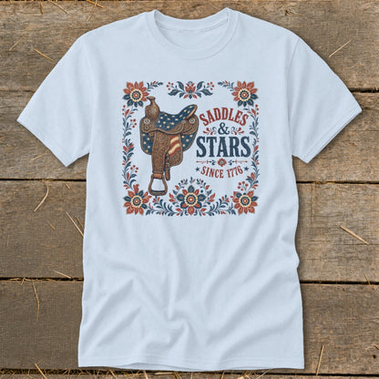 Light blue t-shirt with saddle graphic and text "Saddles & Stars Since 1776".