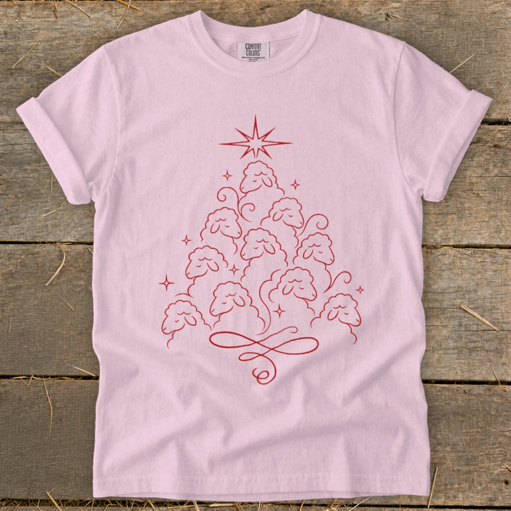 Pink t-shirt with a red line art Christmas tree made of sheep and a star.