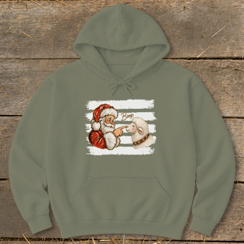 Santa booping a sheep with the word "Boop" on a white striped background.