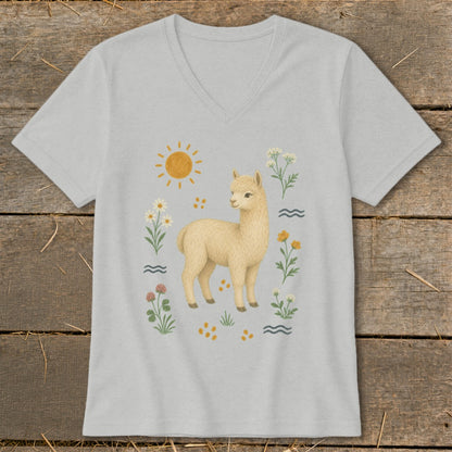 Light grey v-neck t-shirt with a light brown alpaca surrounded by flowers and sun.