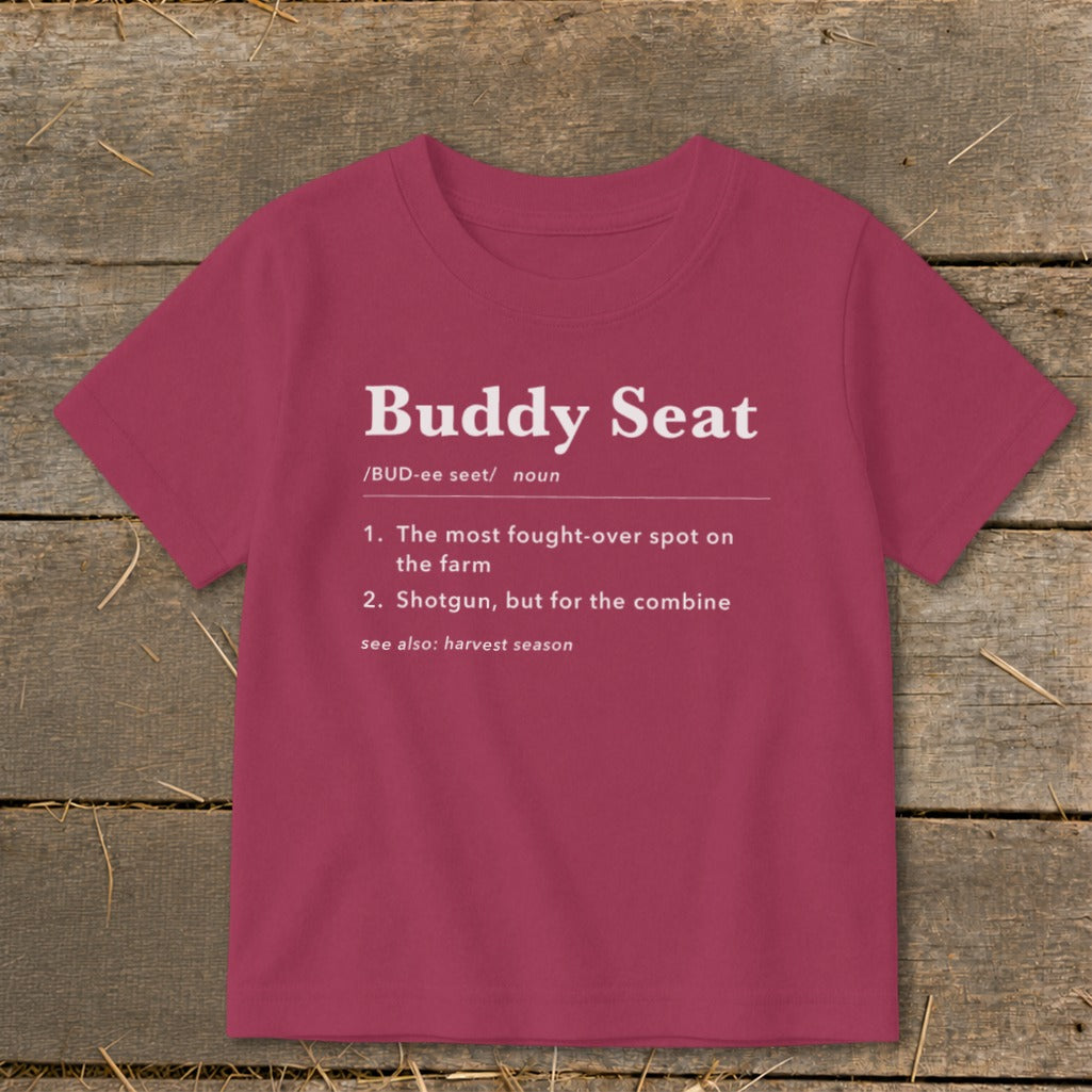 Burgundy t-shirt with white text: "Buddy Seat" definition and "see also: harvest season."