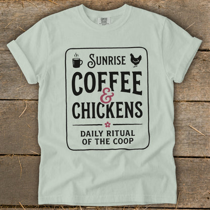 Light mint t-shirt with "Sunrise Coffee & Chickens Daily Ritual of the Coop" graphic.